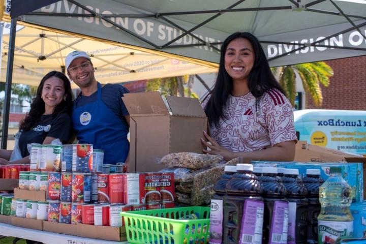 workers at the food pantry pop up smiling